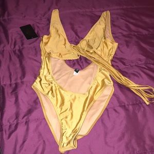 shimmery gold “strappy” bathing suit